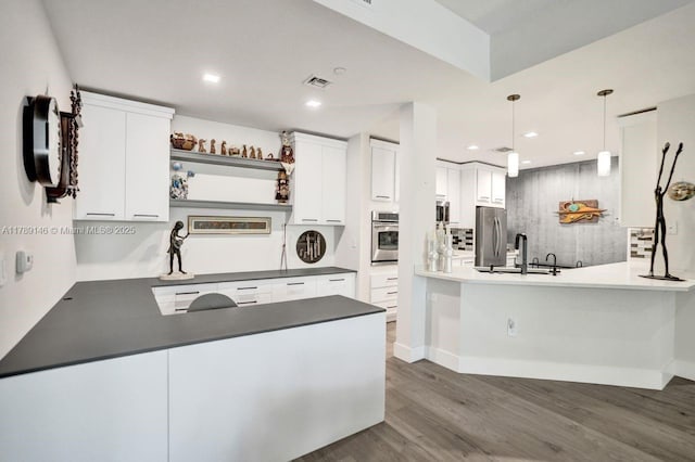 16101 Emerald Estates Dr Unit 342, Weston, FL 33331 - kitchen with a sink, a peninsula, stainless steel appliances, and visible vents