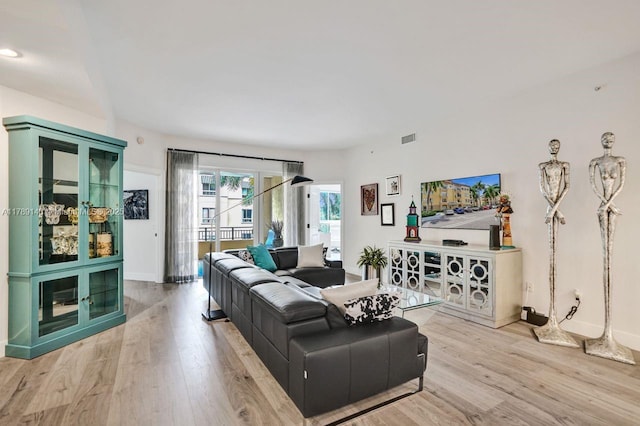 16101 Emerald Estates Dr Unit 342, Weston, FL 33331 - living area featuring light wood finished floors, visible vents, and baseboards
