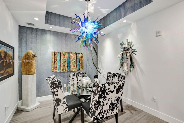 dining room with visible vents, recessed lighting, baseboards, and wood finished floors