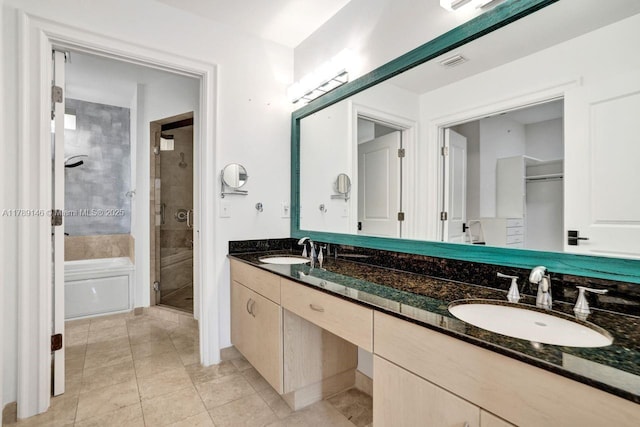 16101 Emerald Estates Dr Unit 342, Weston, FL 33331 - full bathroom featuring a sink, double vanity, a shower stall, and tile patterned flooring