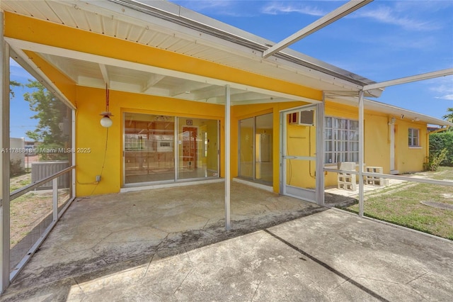 back of property featuring a patio