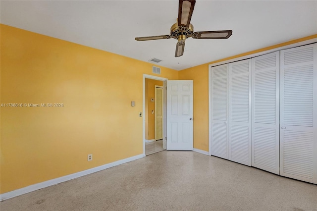 unfurnished bedroom with a closet, visible vents, baseboards, and ceiling fan