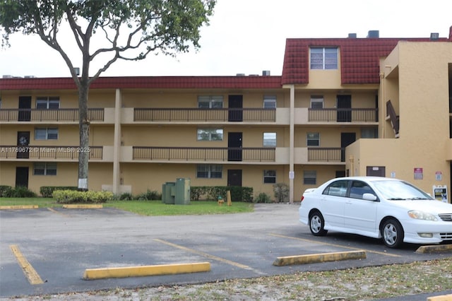 3490 Foxcroft Rd Unit B304, Miramar, FL 33025 - view of apartment building / complex with uncovered parking