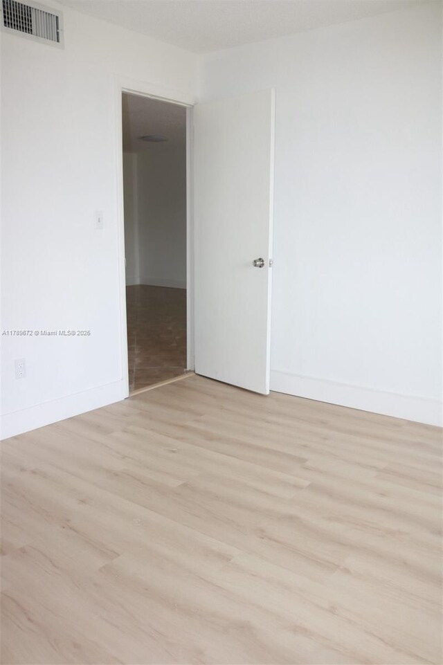 3490 Foxcroft Rd Unit B304, Miramar, FL 33025 - empty room featuring light wood-style floors and baseboards
