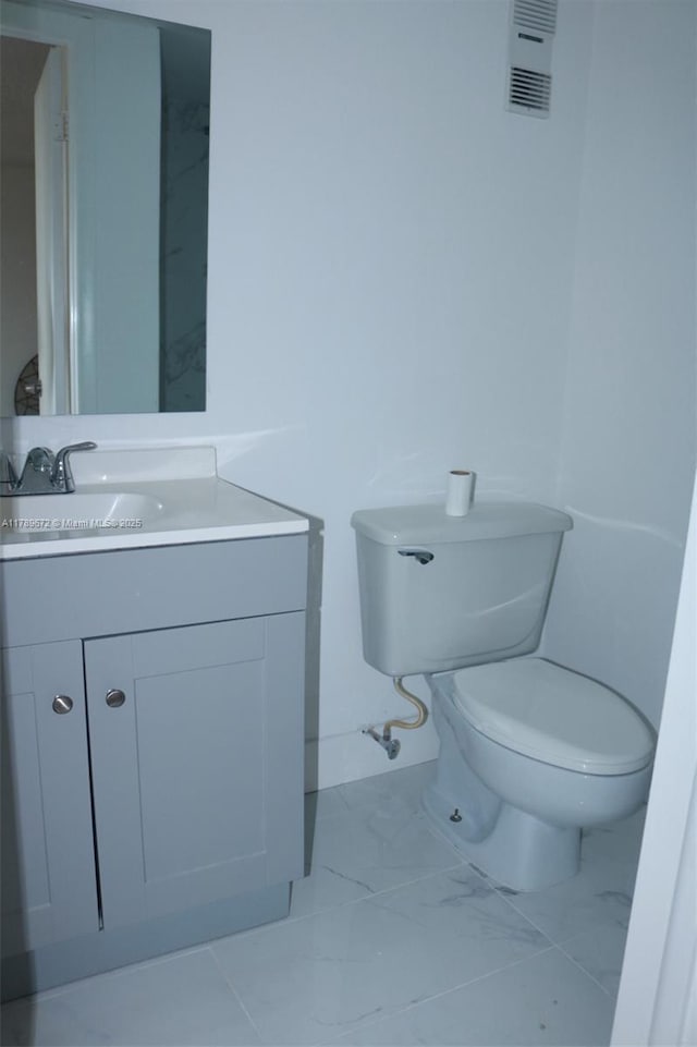 3490 Foxcroft Rd Unit B304, Miramar, FL 33025 - half bath with vanity, toilet, and marble look tiles