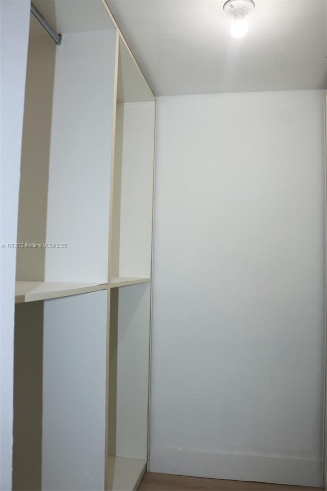 3490 Foxcroft Rd Unit B304, Miramar, FL 33025 - spacious closet featuring wood finished floors