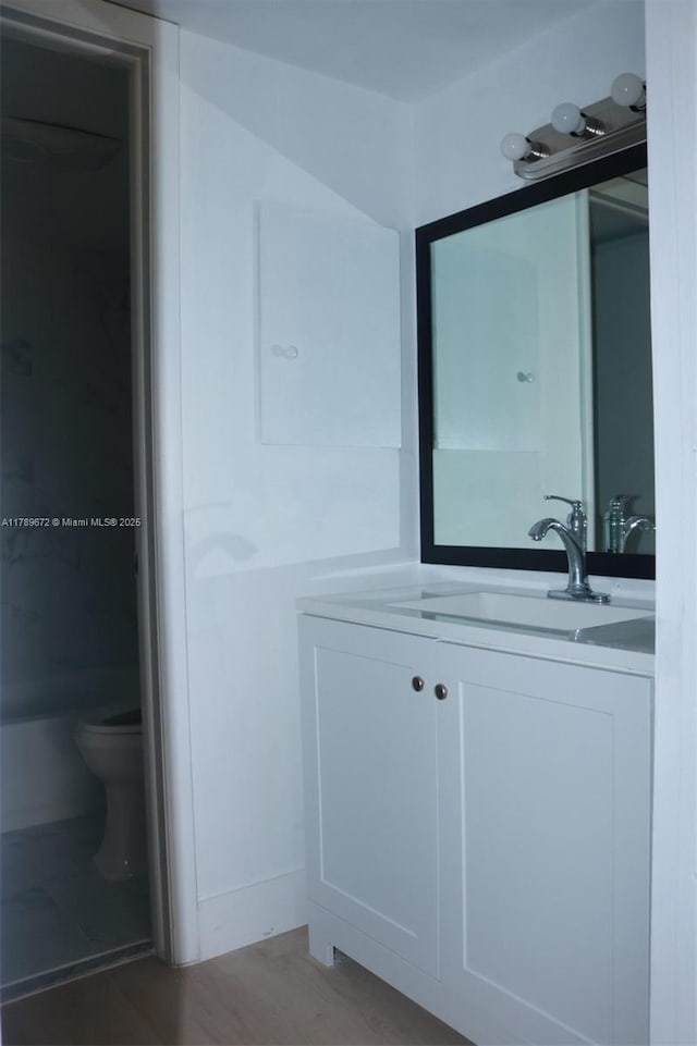 3490 Foxcroft Rd Unit B304, Miramar, FL 33025 - bathroom featuring vanity, toilet, and wood finished floors