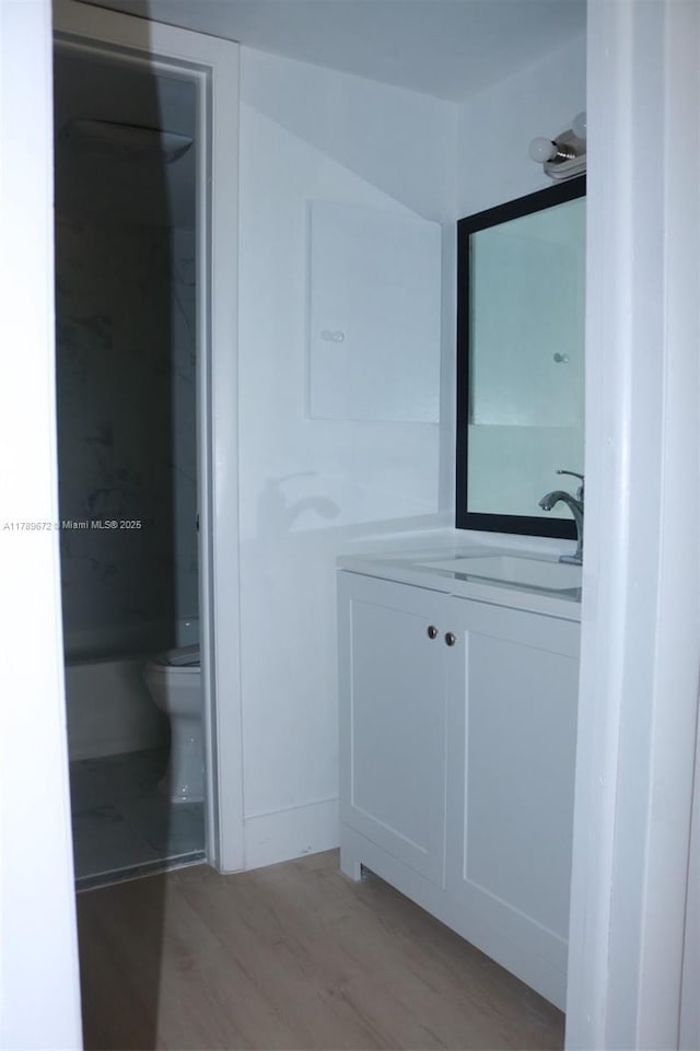 3490 Foxcroft Rd Unit B304, Miramar, FL 33025 - bathroom featuring vanity, toilet, and wood finished floors