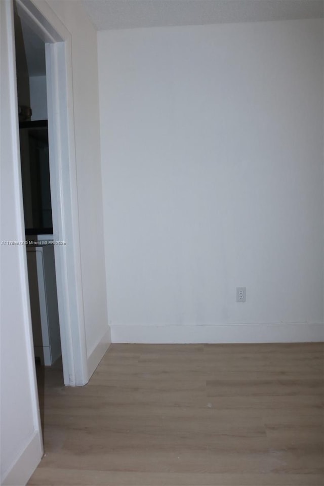 3490 Foxcroft Rd Unit B304, Miramar, FL 33025 - spare room with light wood finished floors and baseboards