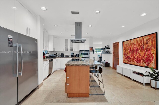 3730 Kumquat Ave, Miami, FL 33133 - kitchen with recessed lighting, a kitchen island, appliances with stainless steel finishes, and island range hood
