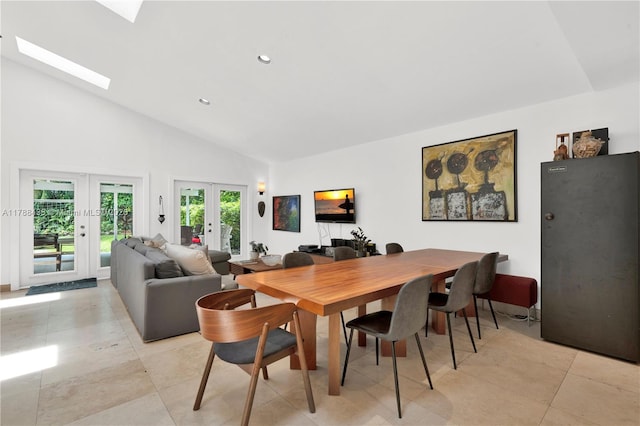 3730 Kumquat Ave, Miami, FL 33133 - dining area with high vaulted ceiling, a skylight, light tile patterned floors, french doors, and recessed lighting