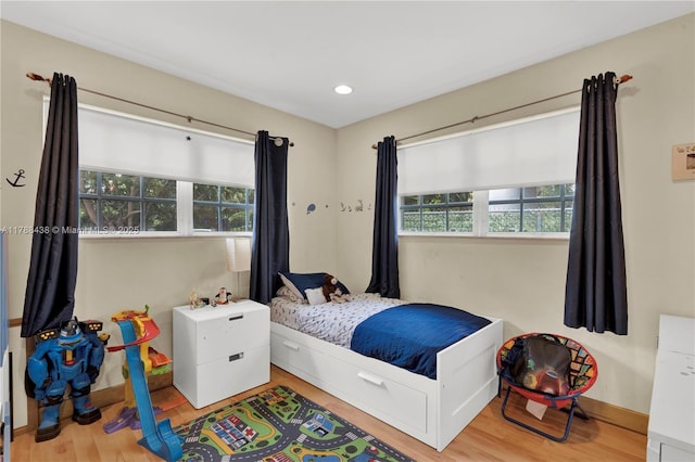 3730 Kumquat Ave, Miami, FL 33133 - bedroom featuring recessed lighting, wood finished floors, and baseboards