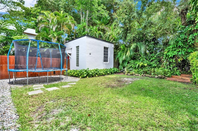 3730 Kumquat Ave, Miami, FL 33133 - view of yard featuring a trampoline and fence