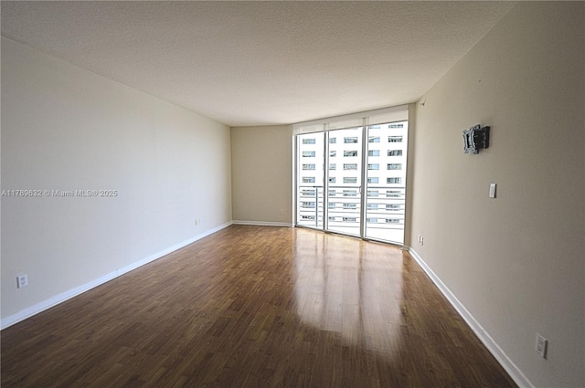 335 S Biscayne Blvd Unit 1904, Miami, FL 33131 - empty room featuring wood finished floors and expansive windows