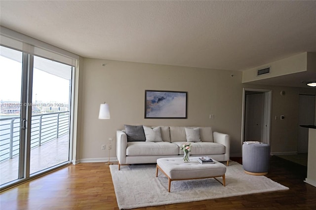 335 S Biscayne Blvd Unit 1904, Miami, FL 33131 - living area featuring wood finished floors and a textured ceiling