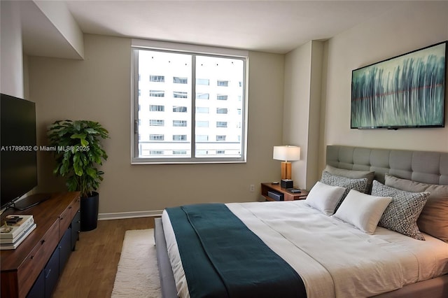 335 S Biscayne Blvd Unit 1904, Miami, FL 33131 - bedroom featuring wood finished floors and multiple windows