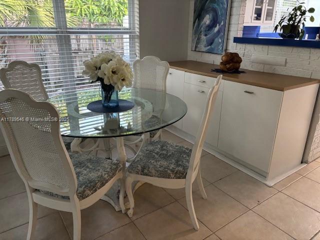 dining room featuring light tile patterned floors and plenty of natural light