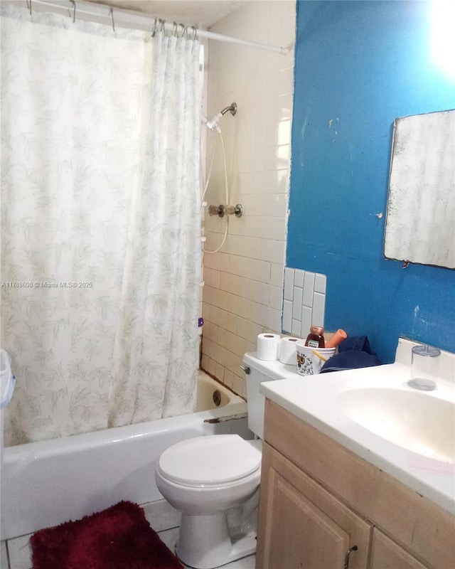 full bathroom featuring shower / bath combination with curtain, toilet, and vanity