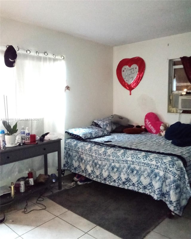 bedroom with tile patterned flooring and cooling unit