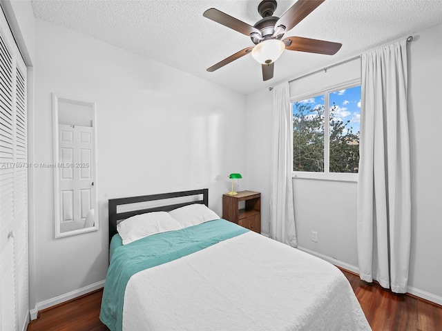 1206 Falls Blvd, Weston, FL 33327 - bedroom with wood finished floors, baseboards, a textured ceiling, and a ceiling fan