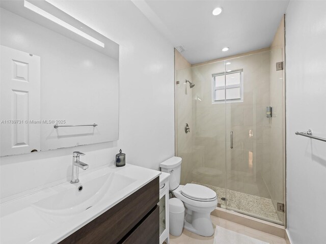 1206 Falls Blvd, Weston, FL 33327 - bathroom featuring toilet, a stall shower, vanity, and recessed lighting