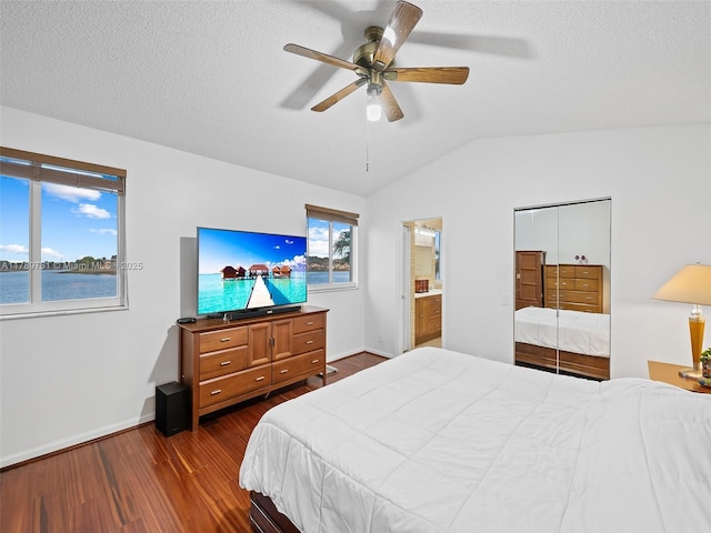 1206 Falls Blvd, Weston, FL 33327 - bedroom featuring dark wood finished floors, lofted ceiling, baseboards, ceiling fan, and connected bathroom
