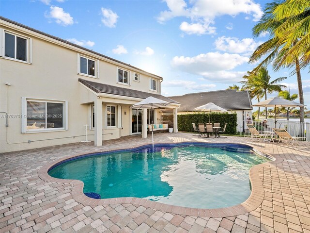 1206 Falls Blvd, Weston, FL 33327 - view of pool featuring a patio area, fence, a gazebo, and outdoor dining area