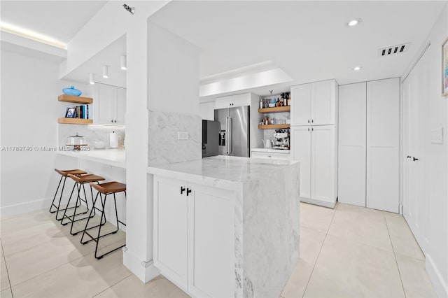 520 Brickell Key Dr Unit A713, Miami, FL 33131 - kitchen featuring open shelves, high quality fridge, a peninsula, white cabinetry, and recessed lighting