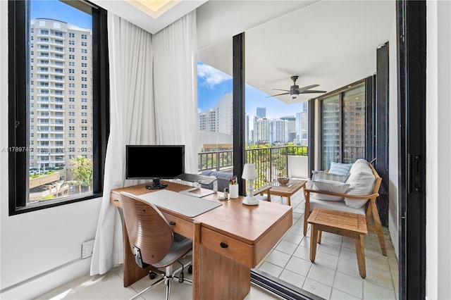 520 Brickell Key Dr Unit A713, Miami, FL 33131 - home office featuring healthy amount of natural light, light tile patterned flooring, and a ceiling fan