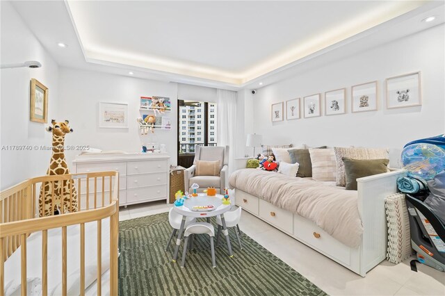 520 Brickell Key Dr Unit A713, Miami, FL 33131 - bedroom with recessed lighting, tile patterned flooring, and a tray ceiling