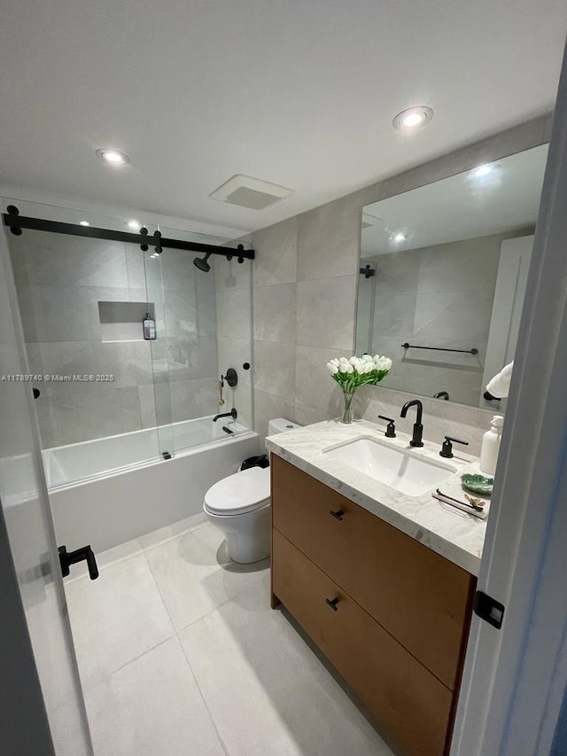 520 Brickell Key Dr Unit A713, Miami, FL 33131 - bathroom featuring vanity, tub / shower combination, toilet, tile patterned floors, and recessed lighting