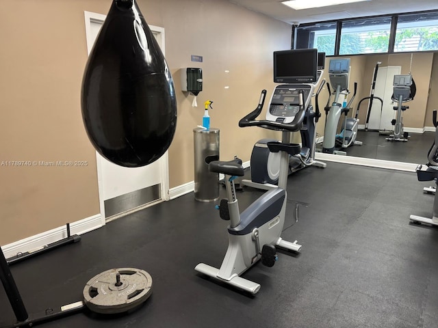 520 Brickell Key Dr Unit A713, Miami, FL 33131 - exercise room featuring baseboards