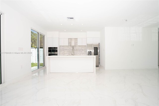 900 SW 24th Rd, Miami, FL 33129 - unfurnished living room featuring recessed lighting, visible vents, a sink, and marble finish floor