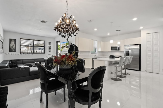 dining area featuring visible vents, recessed lighting, a chandelier, and light tile patterned floors