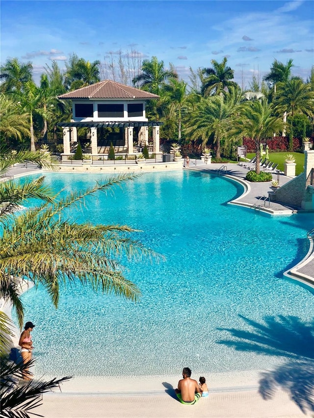pool featuring a gazebo and a patio area