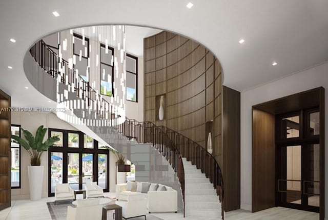 interior space featuring recessed lighting, a towering ceiling, and french doors