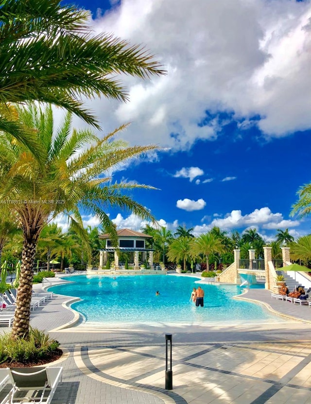 community pool featuring a patio area