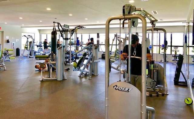 workout area featuring visible vents and recessed lighting