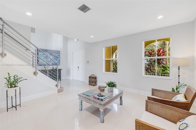 living area with recessed lighting, stairway, visible vents, and baseboards