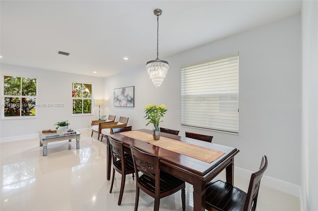 dining space with baseboards, visible vents, recessed lighting, and a notable chandelier