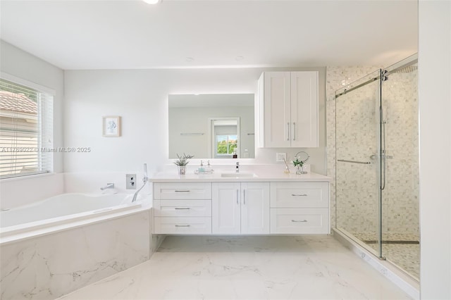 full bath with a bath, a shower stall, a wealth of natural light, and vanity