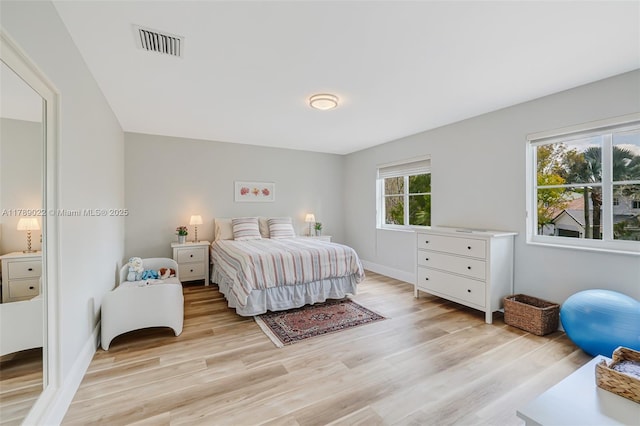 1092 Lavender Cir, Weston, FL 33327 - bedroom with light wood-style floors, visible vents, and baseboards