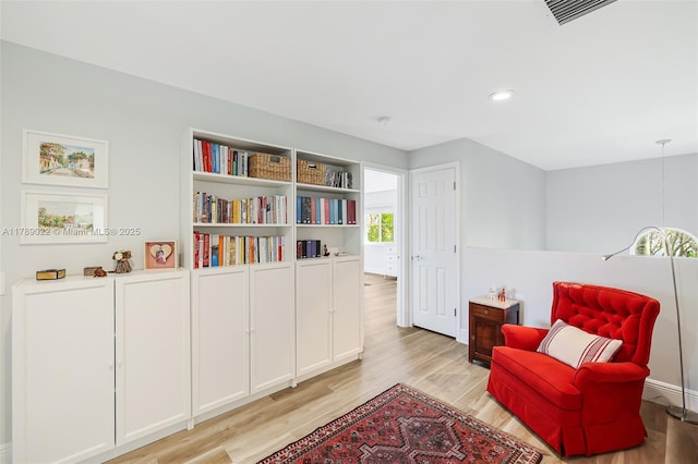 sitting room featuring visible vents, recessed lighting, and light wood-style floors