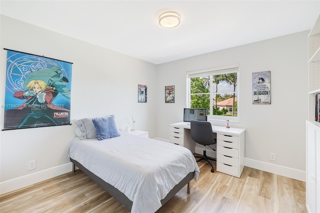 1092 Lavender Cir, Weston, FL 33327 - bedroom featuring light wood-type flooring and baseboards