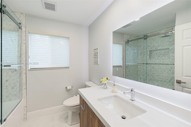 full bathroom with vanity, marble finish floor, baseboards, toilet, and visible vents