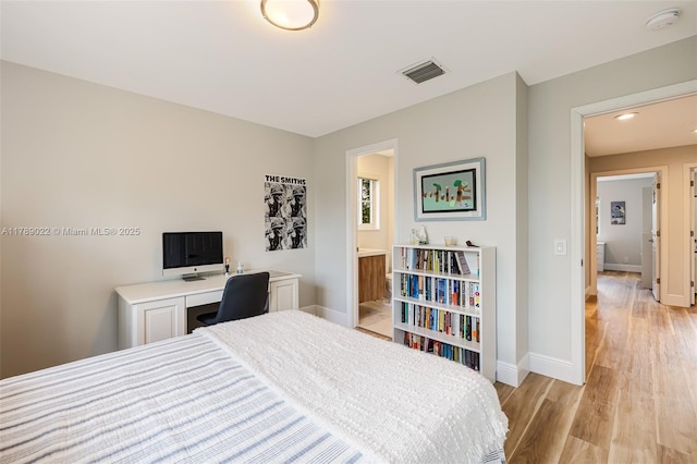 1092 Lavender Cir, Weston, FL 33327 - bedroom featuring connected bathroom, baseboards, visible vents, and light wood-style floors
