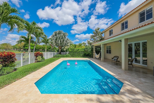 view of swimming pool featuring a patio area, a fenced in pool, and a fenced backyard