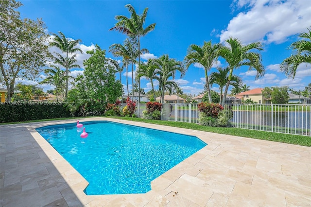 view of pool with fence, a fenced in pool, and a patio