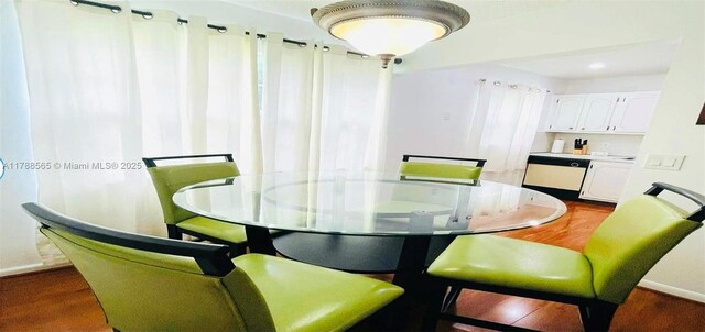 497 W Tilford W Unit W, Deerfield Beach, FL 33442 - dining area featuring baseboards and dark wood-type flooring
