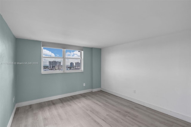 6900 Bay Dr Unit 11F, Miami Beach, FL 33141 - unfurnished room featuring baseboards and wood finished floors